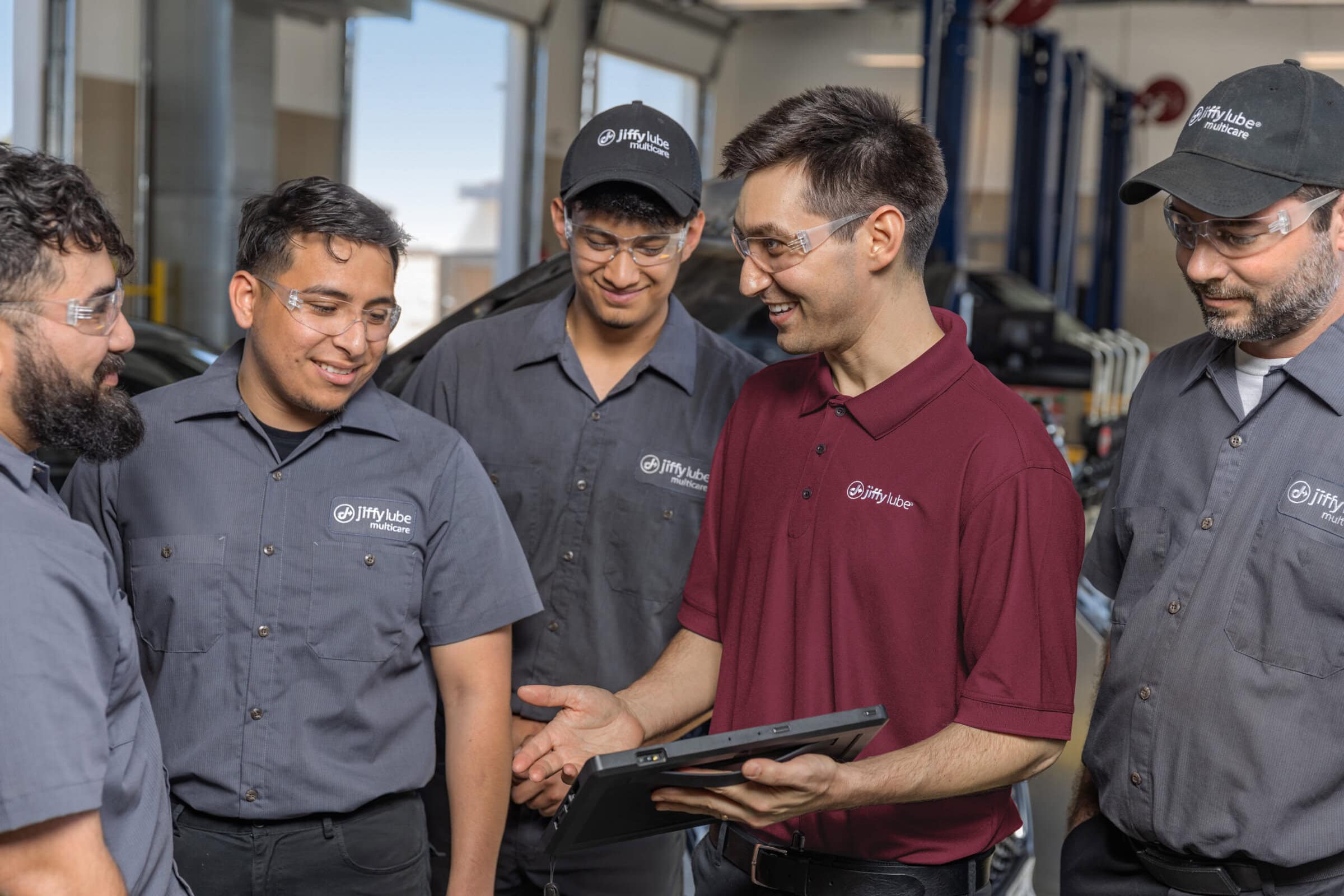 Jiffy lube owner with team